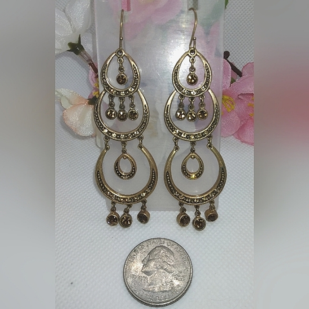 Gold tone dangle earrings with crystals. Good used condition.